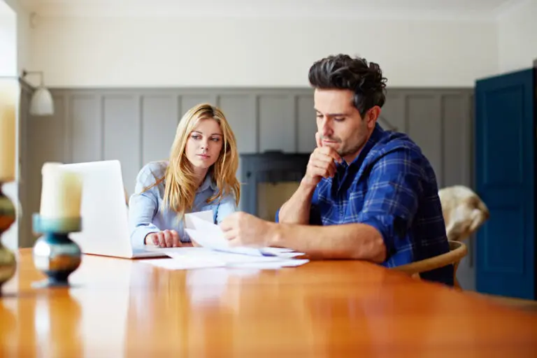 engaged couple discussing finances at home