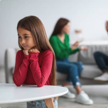 couple arguing in background near child