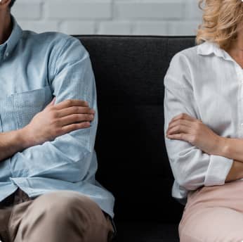 angry couple on couch