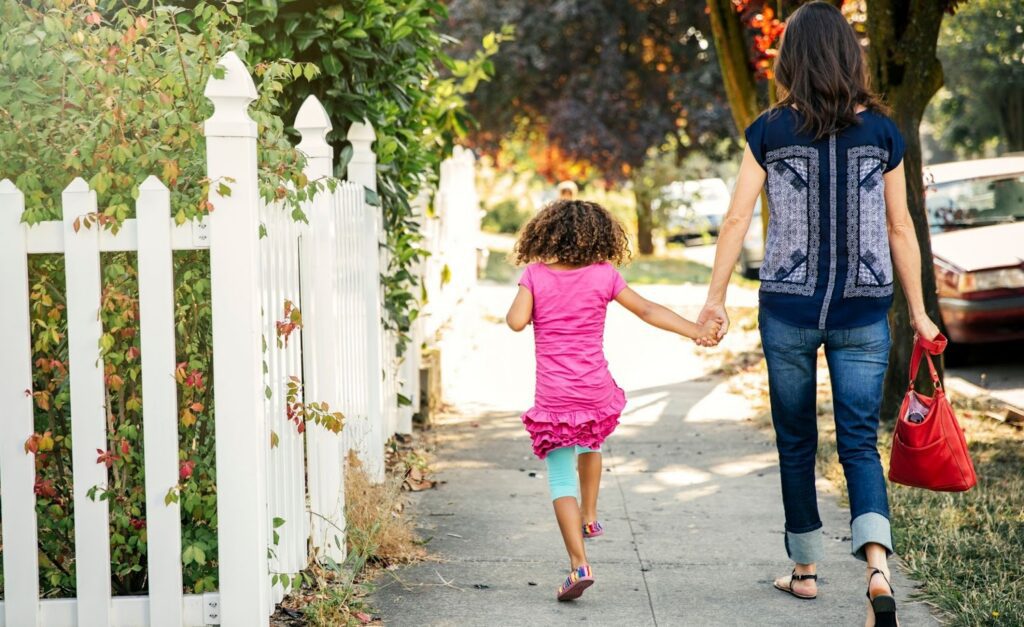 parent child walking neighborhood